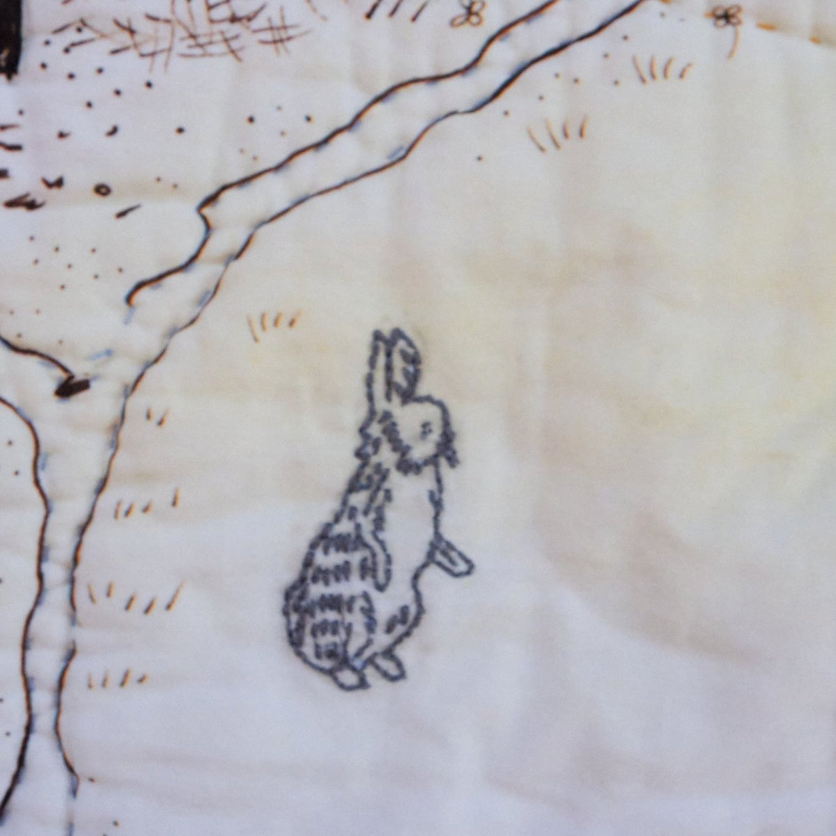 Rabbit embroidered on the Hundred Acre Wood map