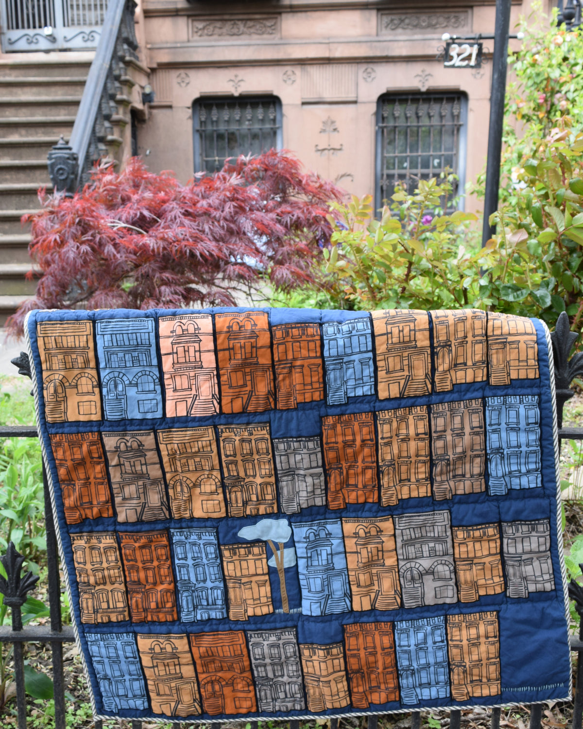 Brownstone Quilt by Haptic Lab on fence